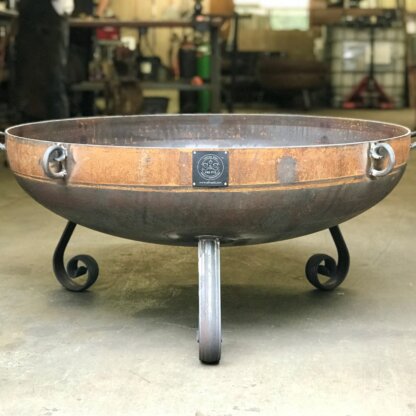 36 inch lowboy style decorative fire pit with three legs.