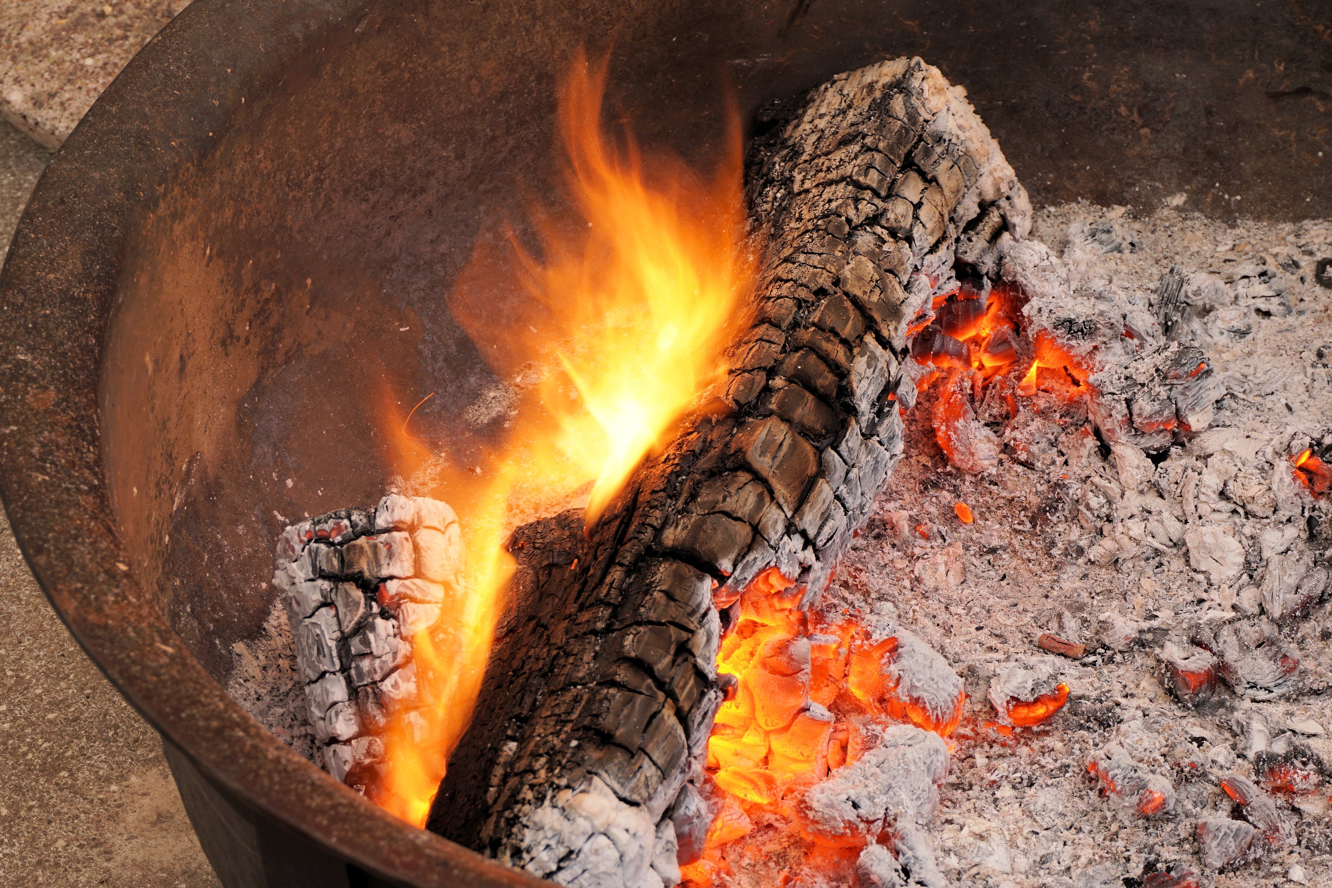 a log burning in a fire pit