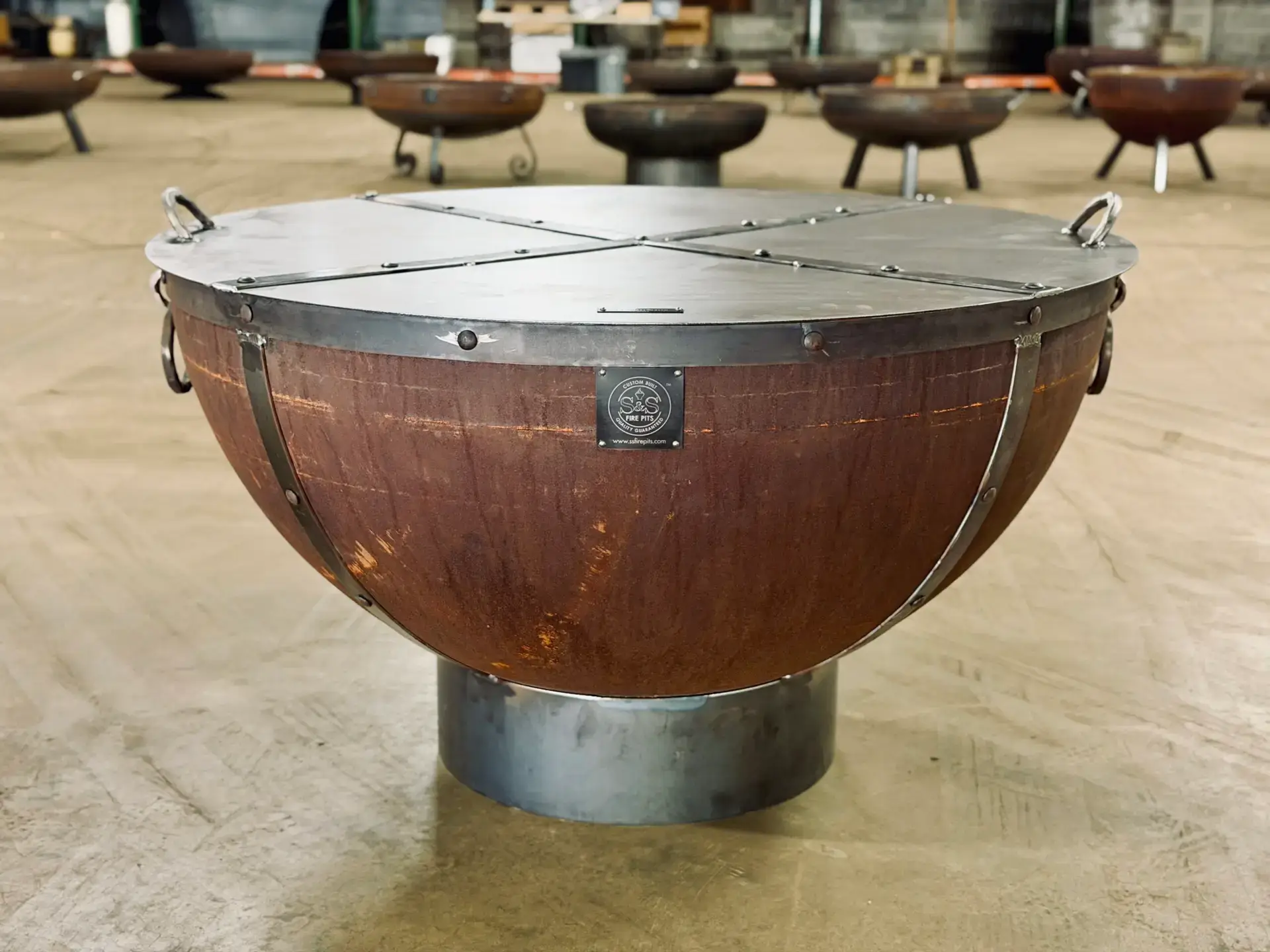 New S&Amp;S Heavy-Gauge Steel Fire Pit With Snuffer Lid On A Metal Stand In The Shop